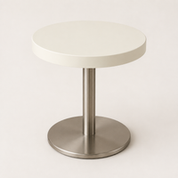 Mesa auxiliar redonda con base cromada